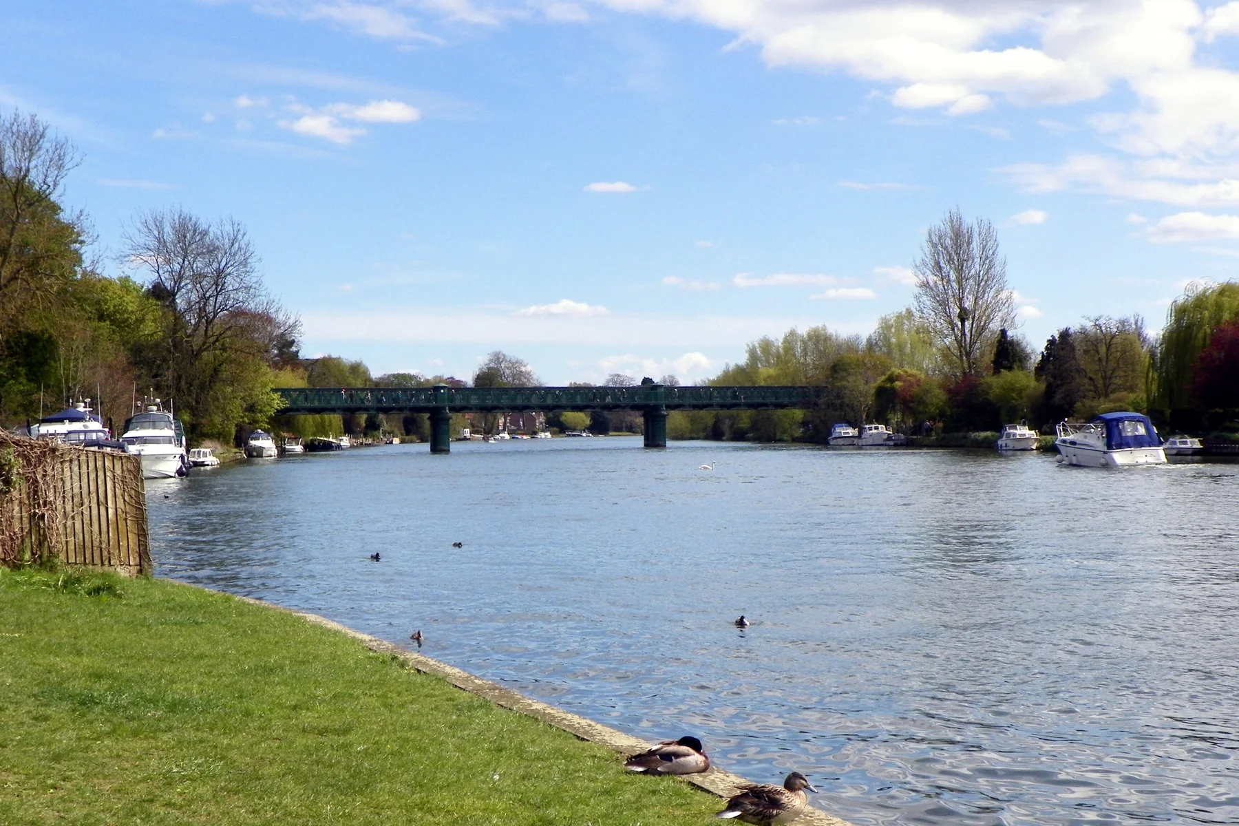 The River Thames at Bourne End, with moored boats and the railway bridge beyond