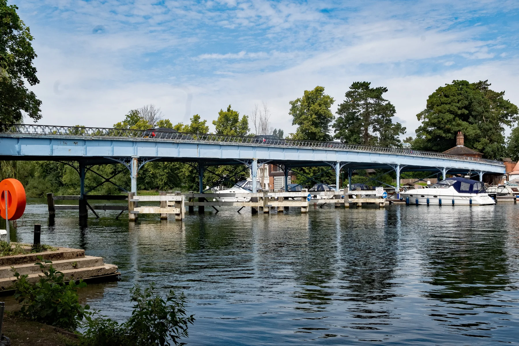 Cookham Bridge over the River Thames, with boats moored along the bank