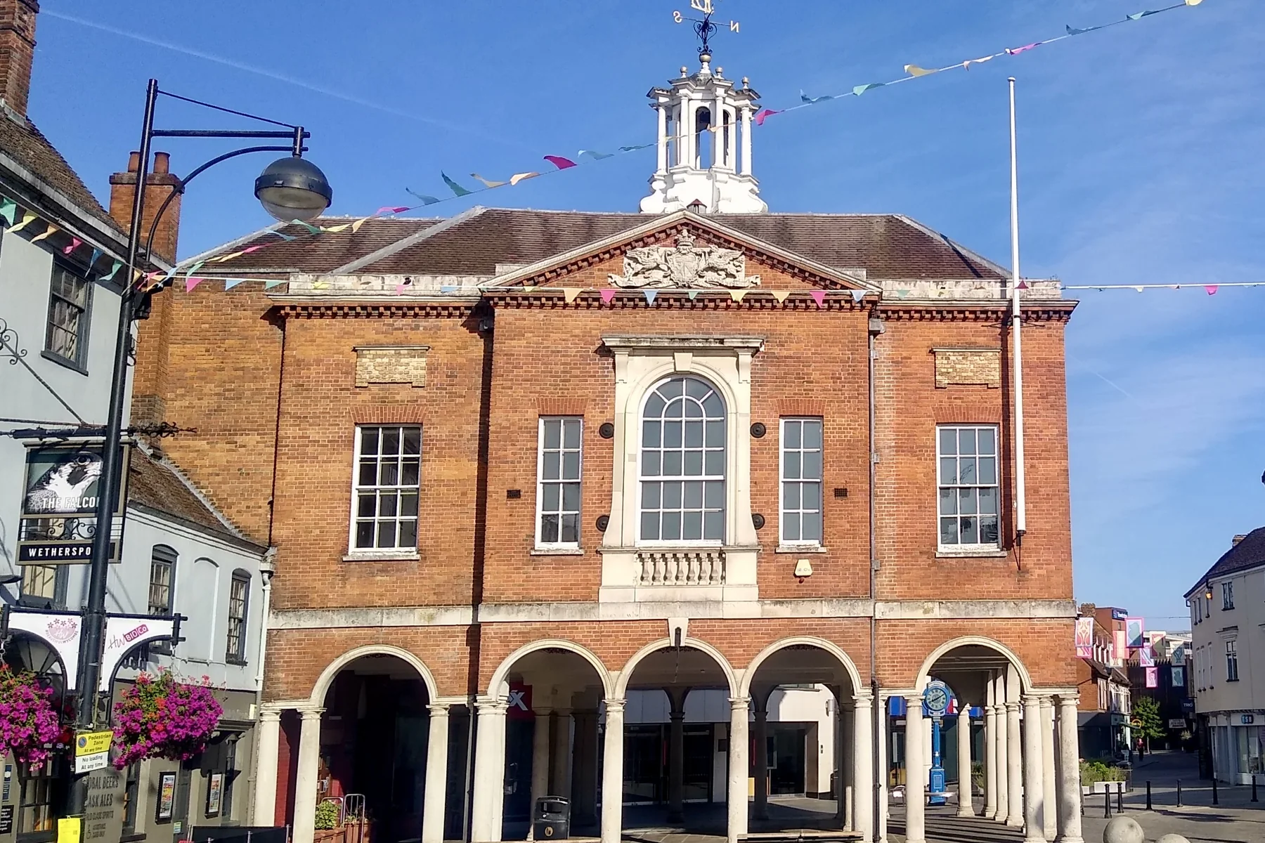 The red brick Guildhall in High Wycombe town centre, with bunting across the street