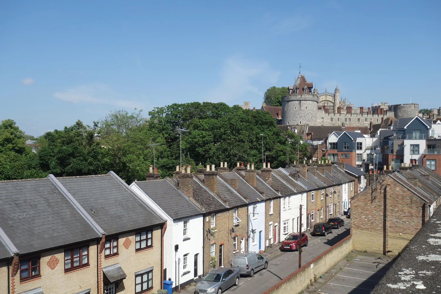 Windsor Castle rising above a terrace of houses in Windsor